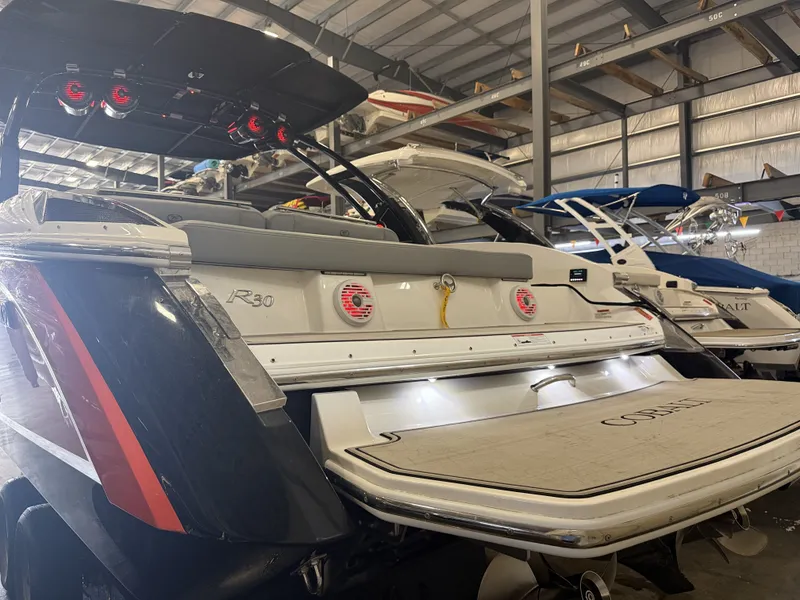 Slide: The Image of The image shows a 2022 Cobalt R30 boat in a storage facility. - 6