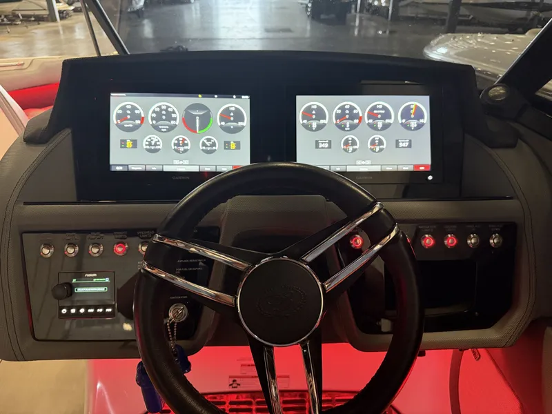 Slide: The Image of The image shows the dashboard of a Cobalt R30 boat with modern digital displays. - 34