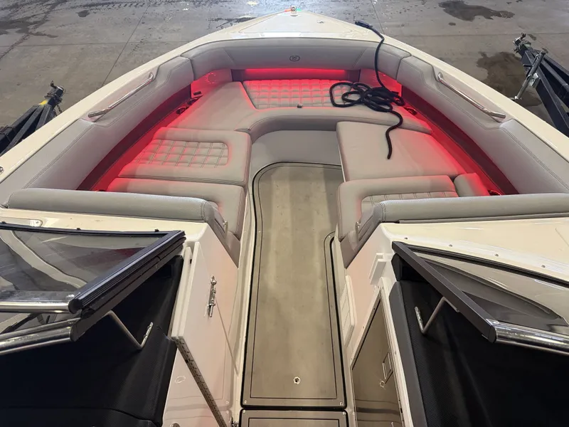 Slide: The Image of The image shows the cockpit of a 2022 Cobalt R30 boat with red lighting. - 44