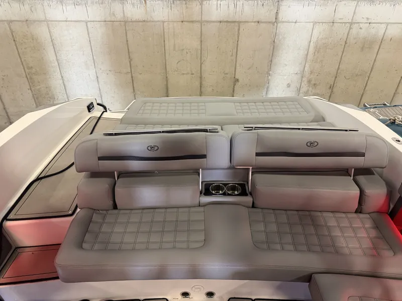 Slide: The Image of The image shows the gray upholstery of a 2022 Cobalt R30 with cup holders. - 19