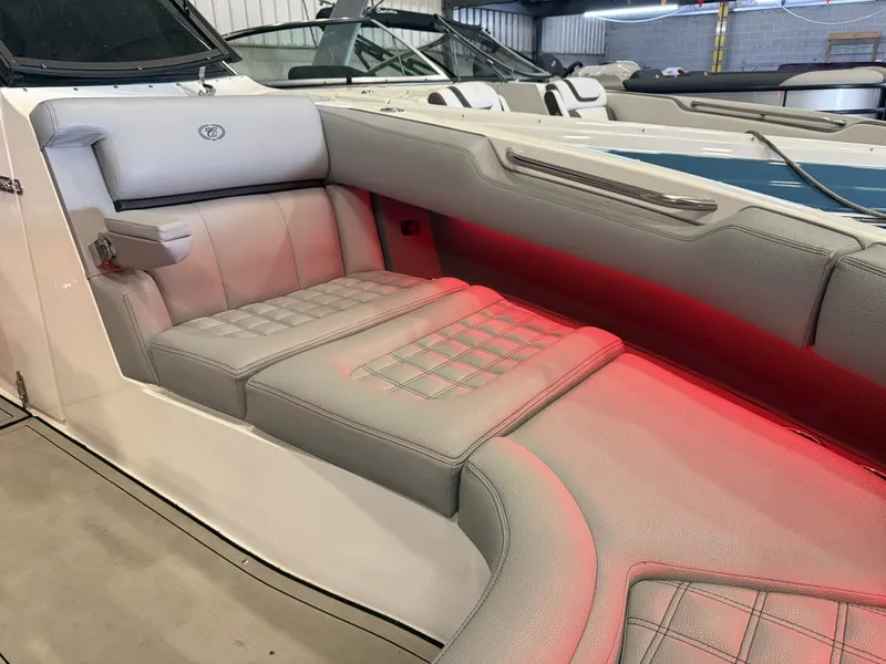 Slide: The Image of The image shows the luxurious gray upholstery of a 2022 Cobalt R30 with red lighting. - 48