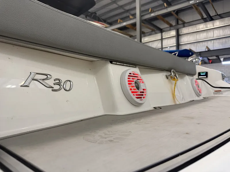 Slide: The Image of The image shows the stern of a 2022 Cobalt R30 boat with speakers. - 10