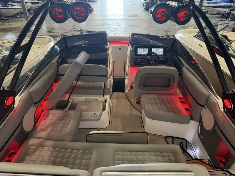 Slide: The Image of The image shows the interior of a 2022 Cobalt R30 boat with stylish lighting. - 18