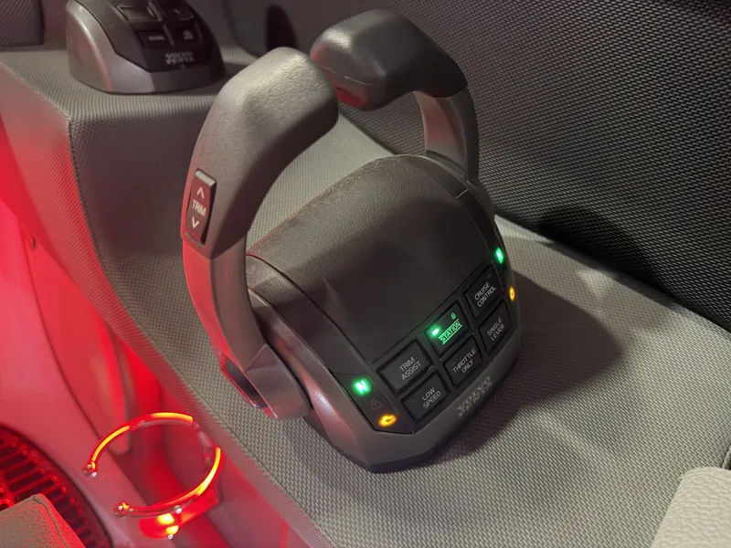 Slide: The Image of Close-up of a control lever with illuminated buttons on a Cobalt boat. - 40