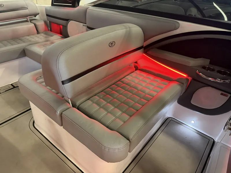 Slide: The Image of The image shows the interior of a 2022 Cobalt R30 boat with sleek, illuminated seating. - 25