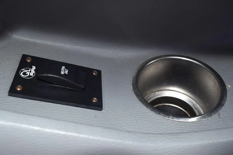 Slide: The Image of Boat control panel and cup holder in 2006 Cobalt 240. - 21