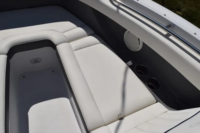 Slide: The Image of Interior seating of a 2006 Cobalt 240 boat with cup holders and speaker. - 14