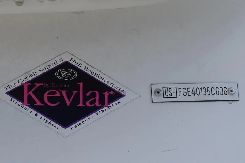 Slide: The Image of 2006 Cobalt 240 boat hull with Kevlar reinforcement label and serial number plate. - 37