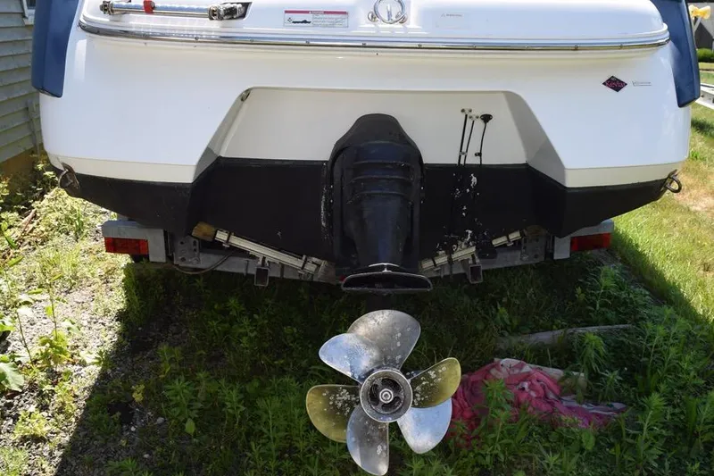 Slide: The Image of Rear view of a 2006 Cobalt 240 boat with visible propeller and outdrive. - 5
