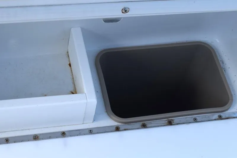 Slide: The Image of Storage compartment on a 2006 Cobalt 240 boat, featuring a clean, white interior. - 26