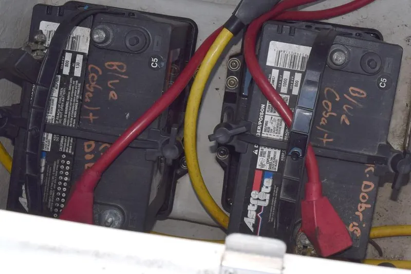 Slide: The Image of Batteries with red and yellow cables in a 2006 Cobalt 240 boat. - 31