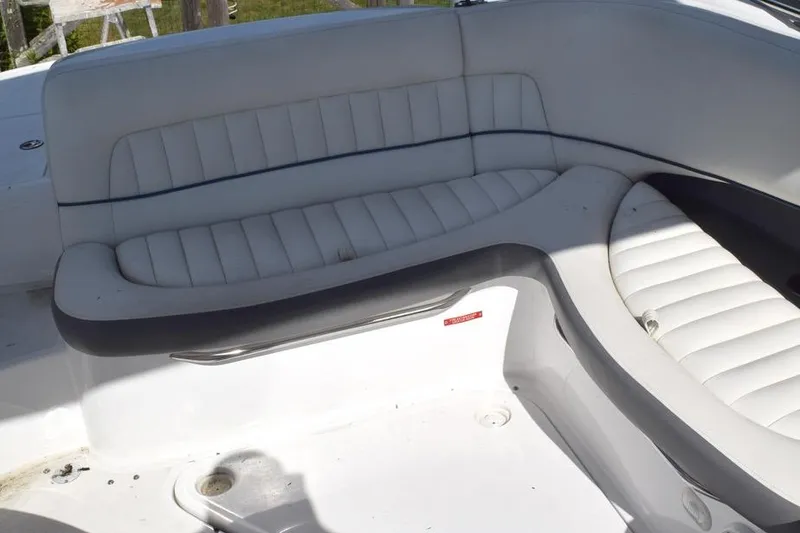 Slide: The Image of White leather seating on a 2006 Cobalt 240 boat, featuring a sleek, curved design. - 18