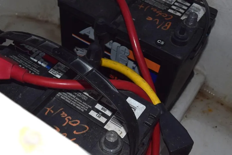 Slide: The Image of Battery setup in a 2006 Cobalt 240 with red and yellow cables. - 30