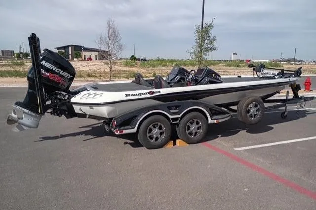 Slide: The Image of 2017 Ranger Z521 Comanche Cup-Equipped boat with Mercury engine in parking lot. - 2