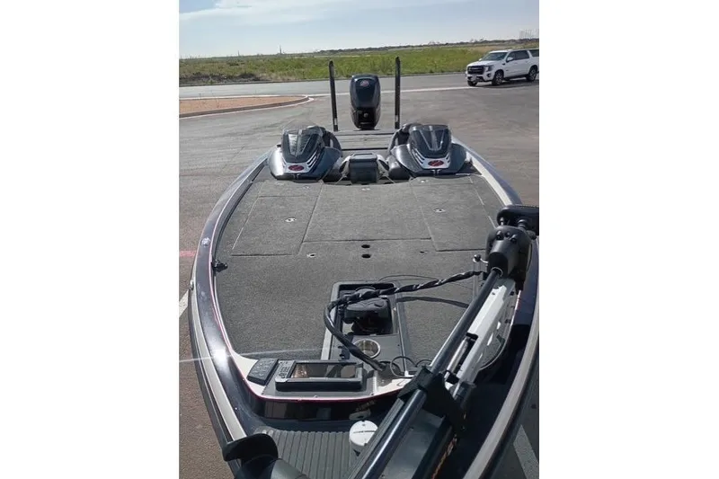 Slide: The Image of 2017 Ranger Z521 Comanche Cup-Equipped boat on a sunny day, parked on pavement. - 10