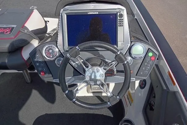 Slide: The Image of 2017 Ranger Z521 Comanche boat dashboard with steering wheel and Lowrance display. - 6