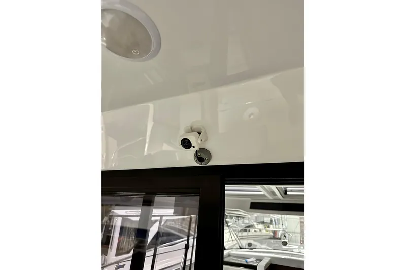 Slide: The Image of 2023 Jeanneau NC Weekender 895 interior with mounted security camera. - 5