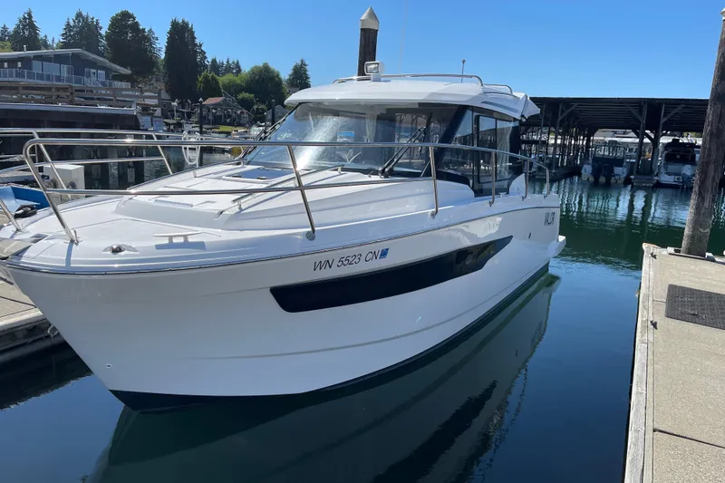 Slide: The Image of 2023 Jeanneau NC Weekender 895 docked at a marina under clear blue skies. - 37