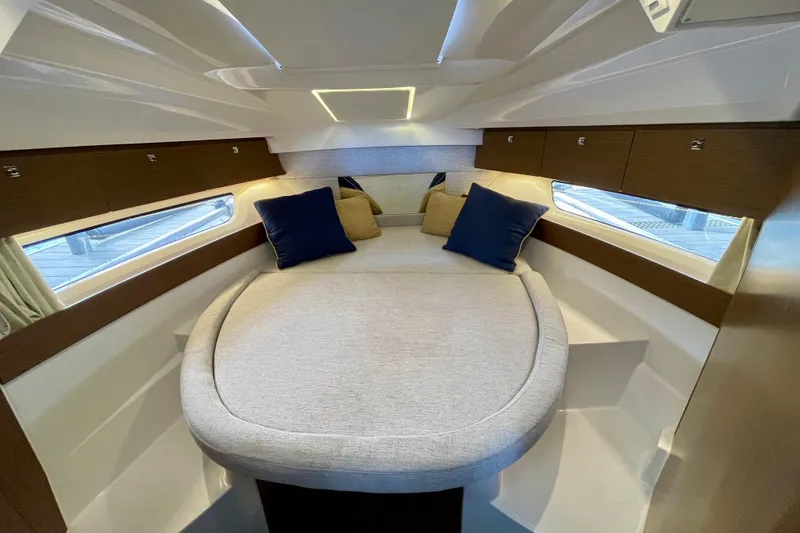 Slide: The Image of Luxurious cabin interior of 2023 Jeanneau NC Weekender 895 with cozy bedding. - 21