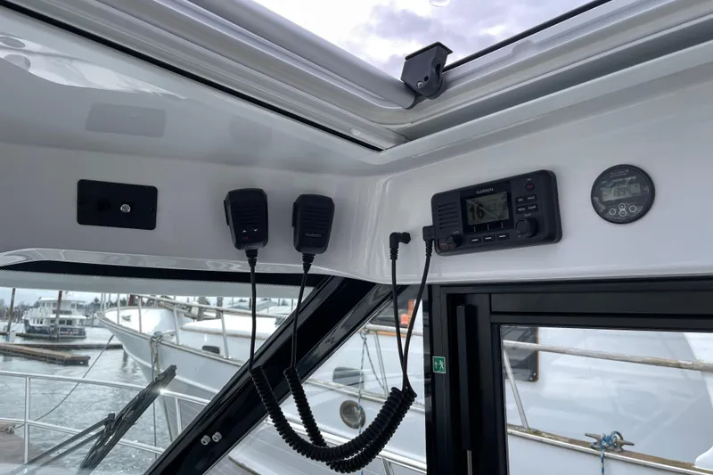 Slide: The Image of Interior view of 2023 Jeanneau NC Weekender 895 boat with communication equipment. - 17