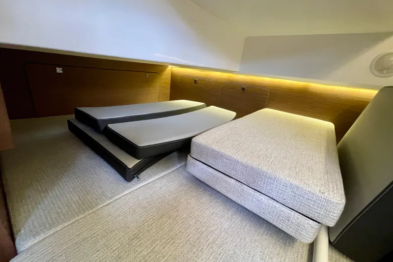 Slide: The Image of Interior cabin of 2023 Jeanneau NC Weekender 895 with modern seating and ambient lighting. - 27
