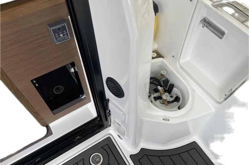 Slide: The Image of 2023 Jeanneau NC Weekender 895 interior detail with control panel and storage compartment. - 35