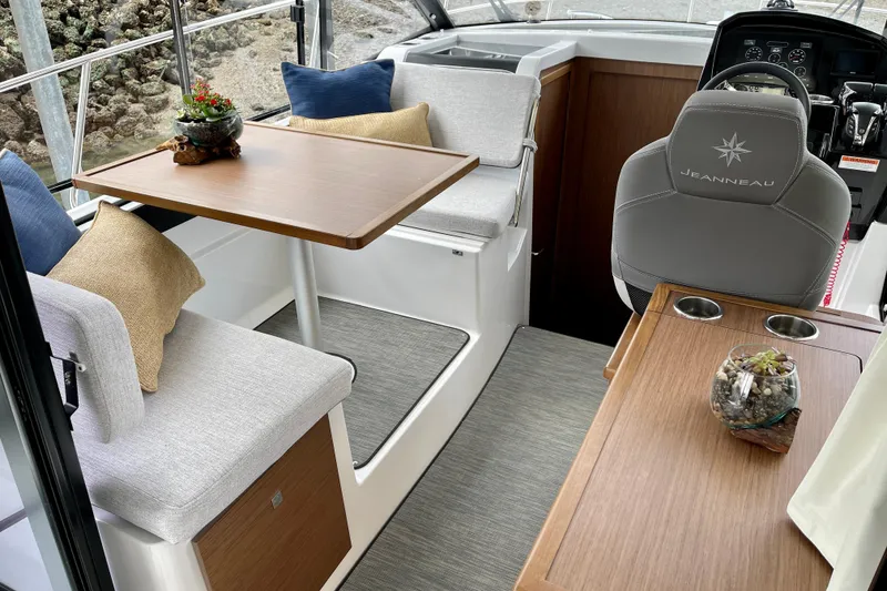 Slide: The Image of Interior of 2023 Jeanneau NC Weekender 895 with seating and helm station. - 10