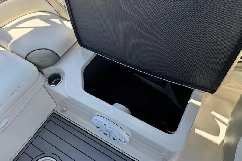 Slide: The Image of Open storage compartment on 2007 Sea Ray 240 Sundeck boat interior. - 32