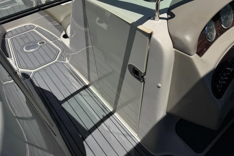 Slide: The Image of 2007 Sea Ray 240 Sundeck interior with sleek design and modern dashboard features. - 42