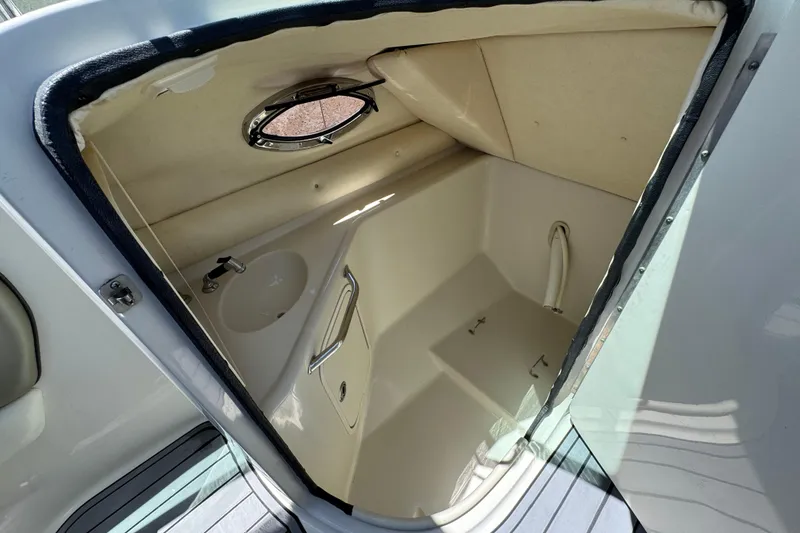 Slide: The Image of Interior of 2007 Sea Ray 240 Sundeck boat cabin with sink and porthole. - 38