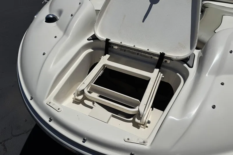 Slide: The Image of Open storage compartment on a 2007 Sea Ray 240 Sundeck boat. - 13