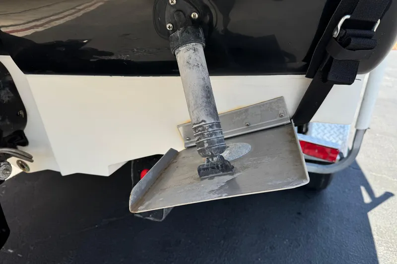 Slide: The Image of Close-up of a 2007 Sea Ray 240 Sundeck boat's trim tab and outdrive. - 10