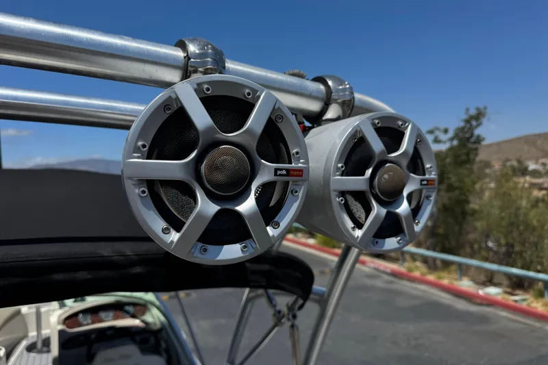 Slide: The Image of Speakers on a 2007 Sea Ray 240 Sundeck boat, clear sky background. - 16