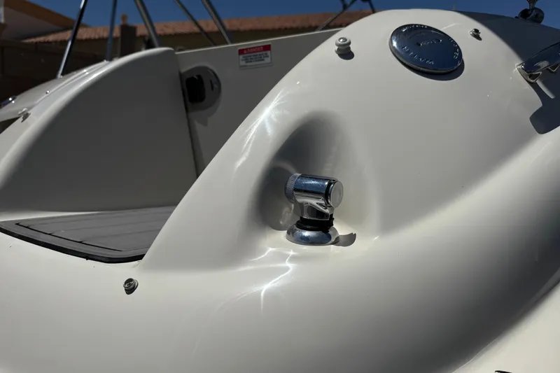 Slide: The Image of Close-up of a 2007 Sea Ray 240 Sundeck boat's deck detail with chrome fittings. - 7