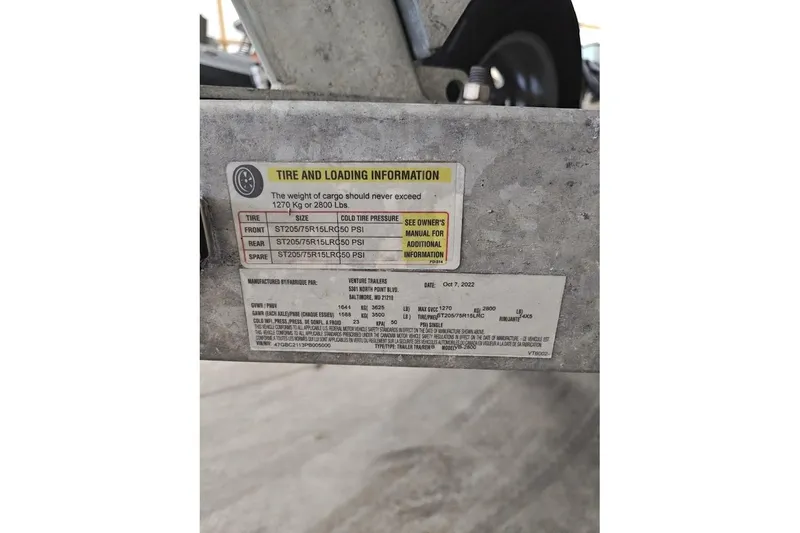 Slide: The Image of Tire and loading information label on a 2023 Highfield Patrol 600 boat trailer. - 14
