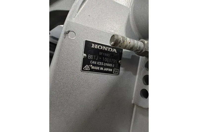Slide: The Image of Honda engine plate on Highfield Patrol 600, 2023 model, showing serial and manufacturing details. - 11