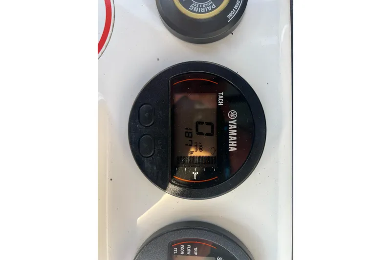 Slide: The Image of Yamaha tachometer on 2019 Sea Hunt Ultra 234 boat dashboard. - 17