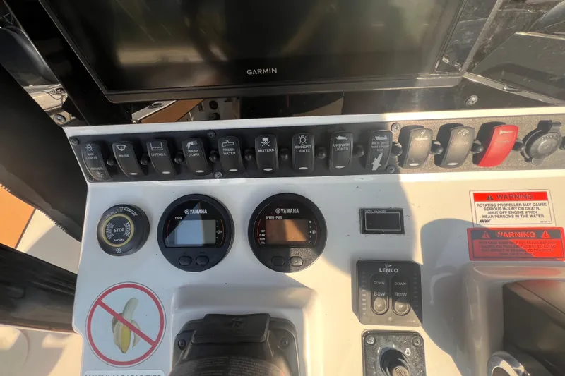 Slide: The Image of Control panel of a 2019 Sea Hunt Ultra 234 boat with Yamaha gauges and switches. - 14