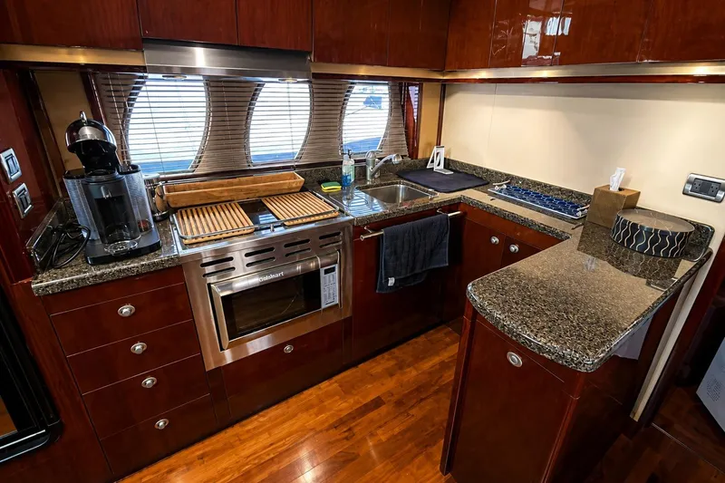 Slide: The Image of Luxurious kitchen interior of 2007 Sea Ray 48 Sundancer yacht with modern appliances. - 5