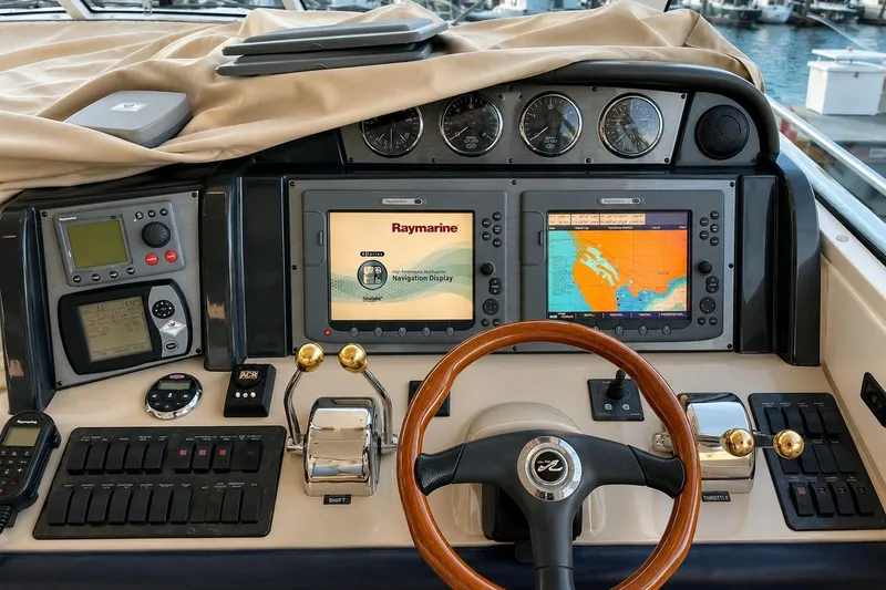Slide: The Image of Helm of 2007 Sea Ray 48 Sundancer with navigation displays and controls. - 3