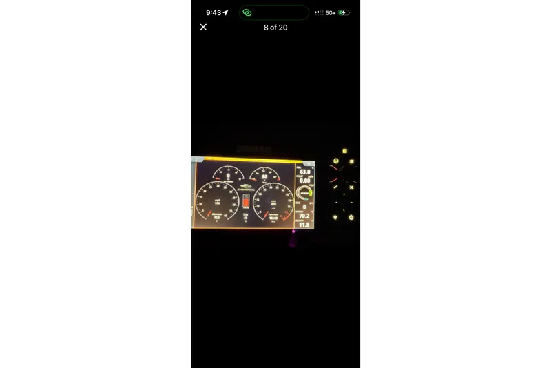 Slide: The Image of Dashboard display of 2023 Chaparral 307 SSX boat at night. - 5