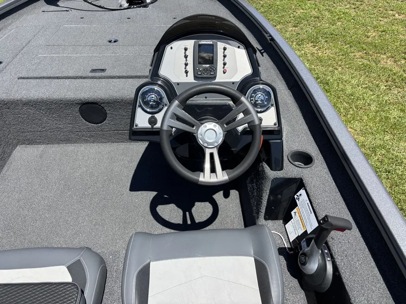 Slide: The Image of The image shows the cockpit of a 2018 Lowe Stinger 178 boat with a modern helm. - 10