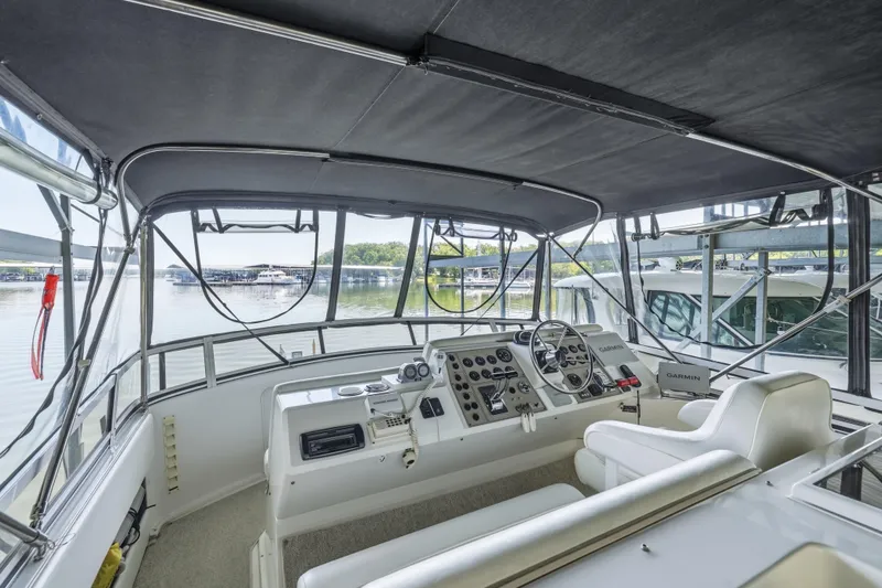 Slide: The Image of Interior view of 2000 Carver 406 Aft Cabin Motor Yacht helm with navigation equipment. - 20