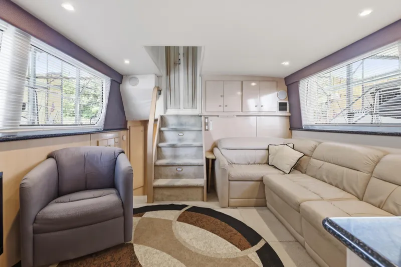 Slide: The Image of Interior of 2000 Carver 406 Aft Cabin Motor Yacht with plush seating and modern decor. - 43