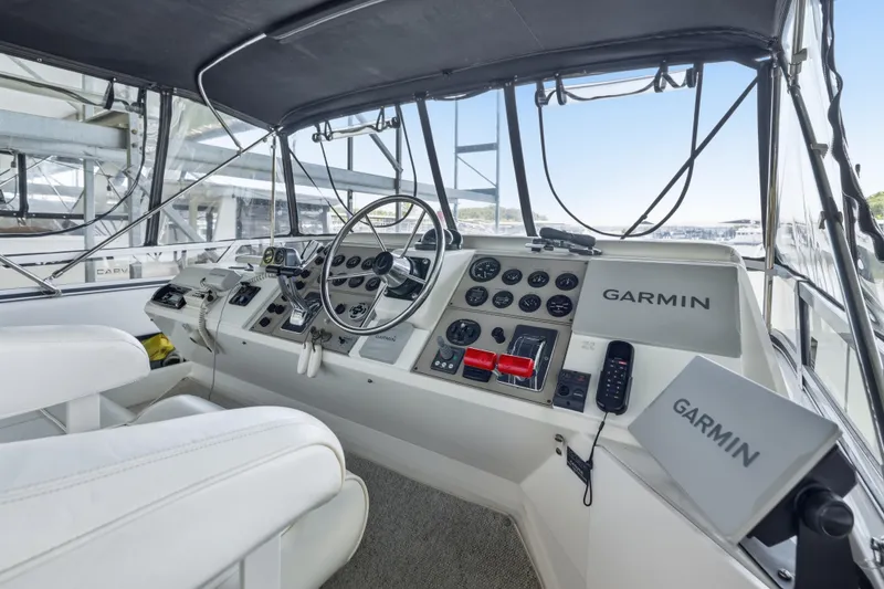 Slide: The Image of Helm of 2000 Carver 406 Aft Cabin Motor Yacht with Garmin navigation system. - 13
