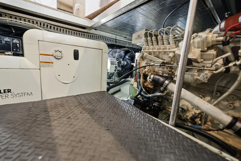 Slide: The Image of Engine room of 2000 Carver 406 Aft Cabin Motor Yacht, showcasing mechanical components. - 71