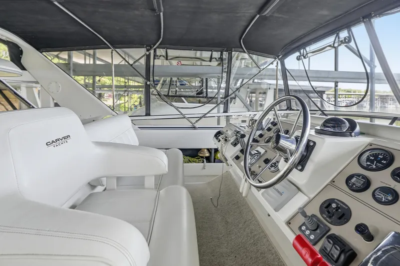 Slide: The Image of Helm of 2000 Carver 406 Aft Cabin Motor Yacht with steering wheel and control panel. - 15