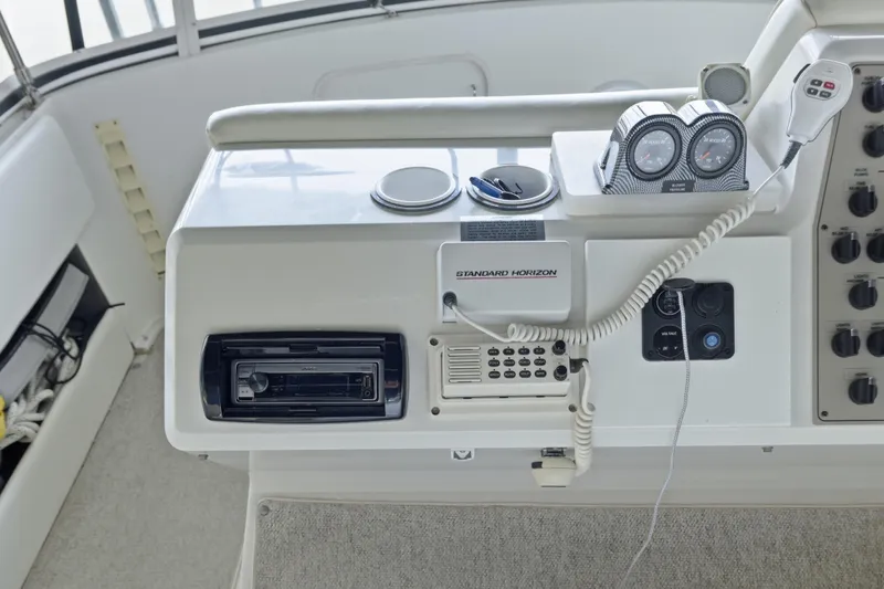 Slide: The Image of Control panel of 2000 Carver 406 Aft Cabin Motor Yacht with navigation and communication equipment. - 10