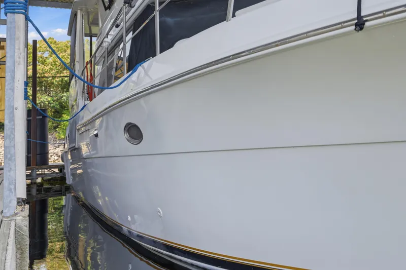 Slide: The Image of 2000 Carver 406 Aft Cabin Motor Yacht docked, side view. - 35