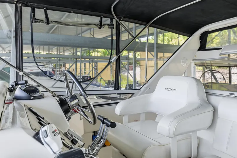 Slide: The Image of Interior of 2000 Carver 406 Aft Cabin Motor Yacht with steering wheel and captain's chair. - 18